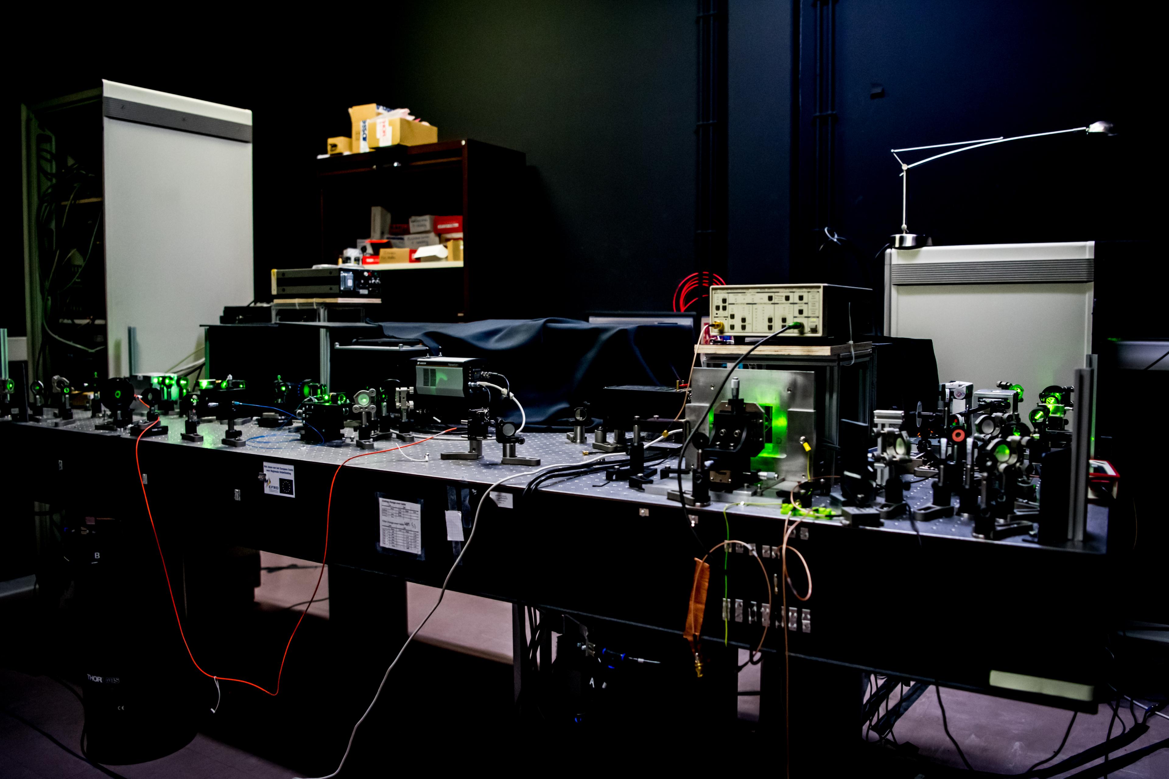 The optical table with a room temperature quantum microscope setup used in the single nuclear spin readout experiment.